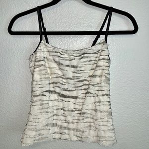 White, gray, and black ruffled tank top.
